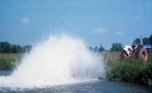 Tractor-powered paddlewheels provide emergency pond aeration