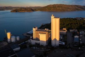 exterior of Skretting's feed mill in Norway at sunset